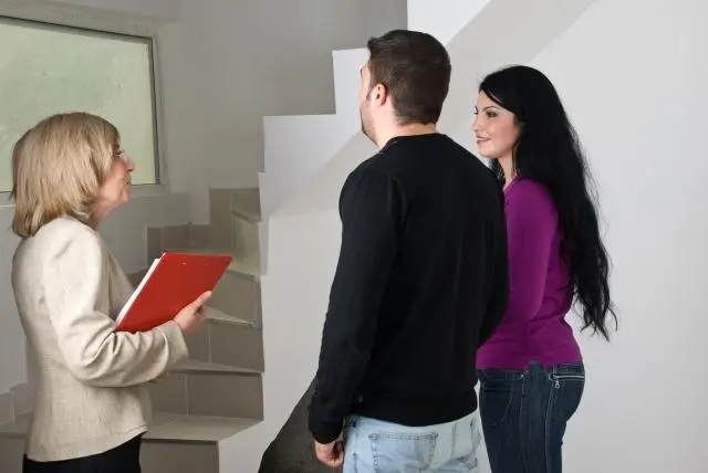 Realtor showing a single family home to buyers in Prince Edward Island